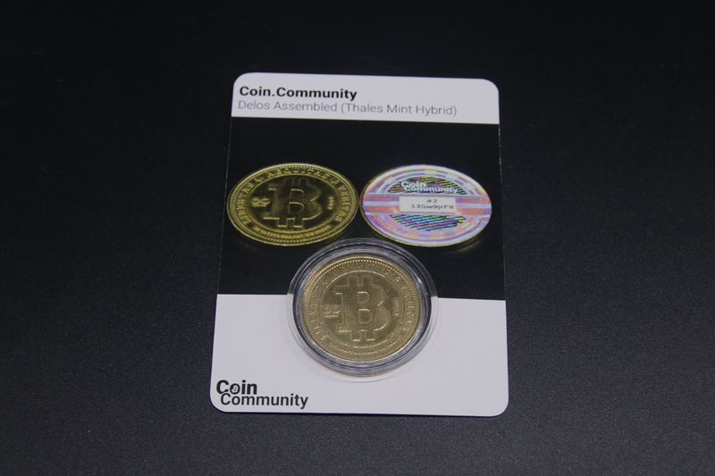 File:Coin.Community - Delos Assembled Carded 3 front.jpg